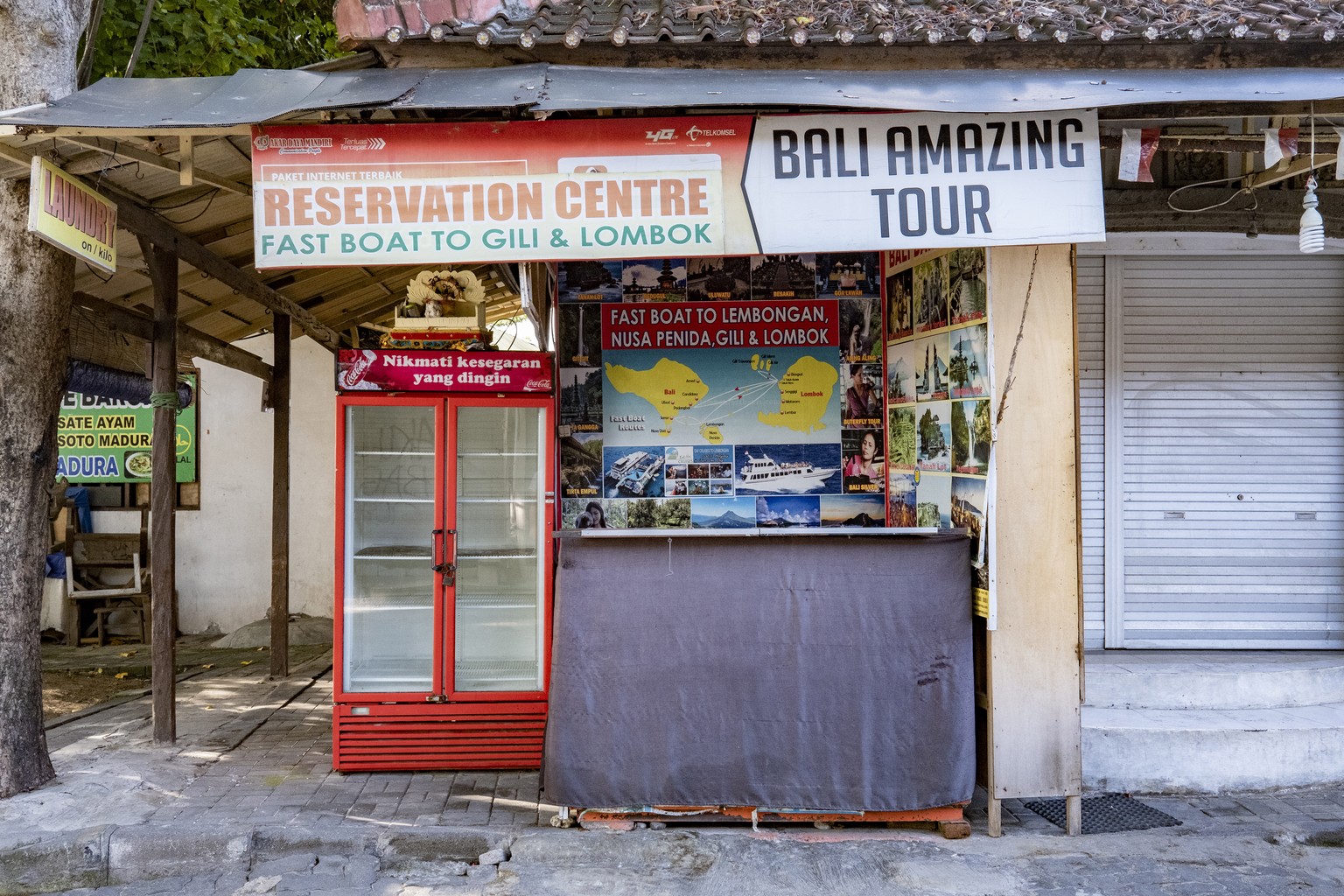 epa08515365 A closed tour operator booth in Kuta, Bali, Indonesia, 29 June 2020. According to local media reports, the Bali government has already prepared to welcome domestic tourists in August by im ...
