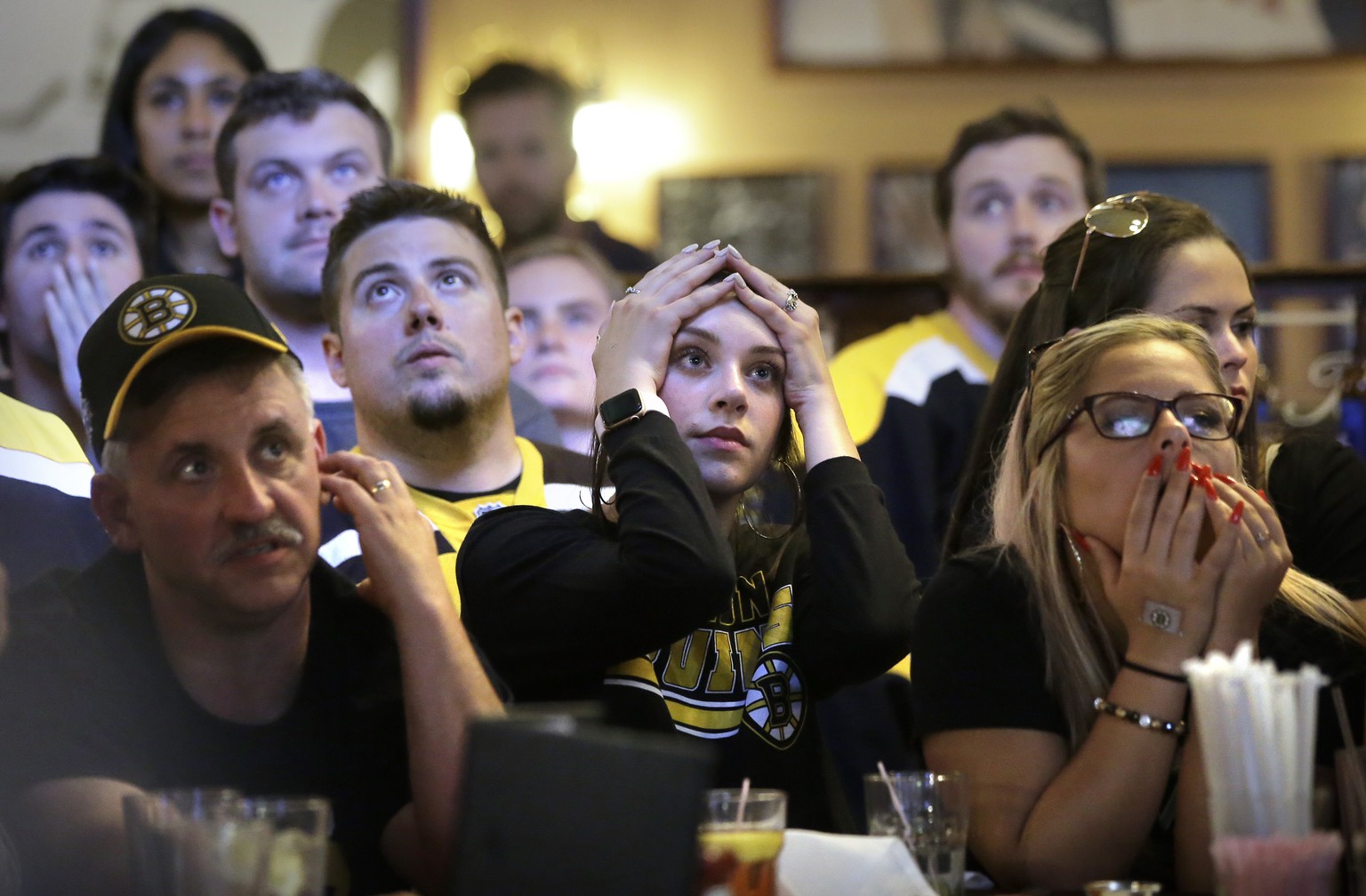 Boston Bruins fans react as the St. Louis Blues score a goal, as the fans watch television coverage of Game 7 of the NHL hockey Stanley Cup Final on Wednesday, June 12, 2019, at a bar in Boston. (AP P ...