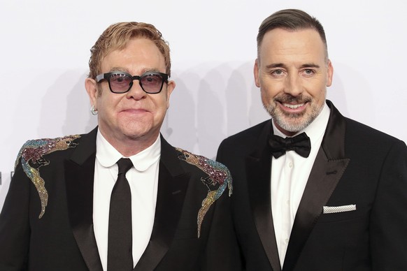 Elton John, left, and David Furnish attend the Elton John AIDS Foundation&#039;s 15th Annual An Enduring Vision Benefit at Cipriani Wall Street on Wednesday, Nov. 2, 2016, in New York. (Photo by Greg  ...