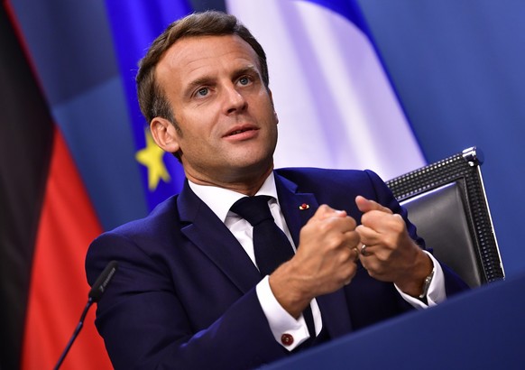 French President Emmanuel Macron speaks during a media conference at the end of an EU summit in Brussels, Tuesday, July 21, 2020. Weary European Union leaders finally clinched an unprecedented budget  ...