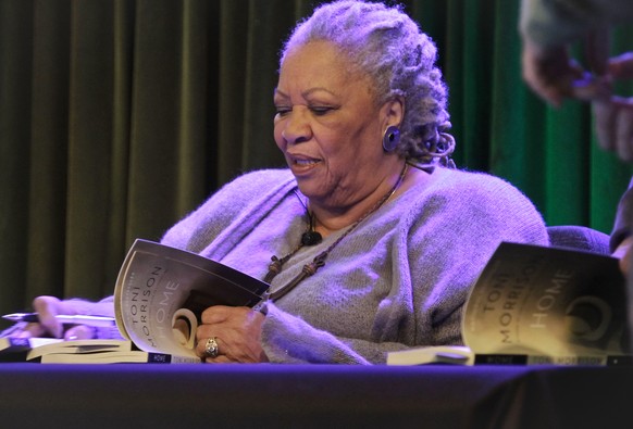 FILE - In this Feb. 27, 2013 file photo, author Toni Morrison signs copies of her latest book &quot;Home,&quot; during Google&#039;s online program series, Authors At Google, in New York. Morrison&#03 ...