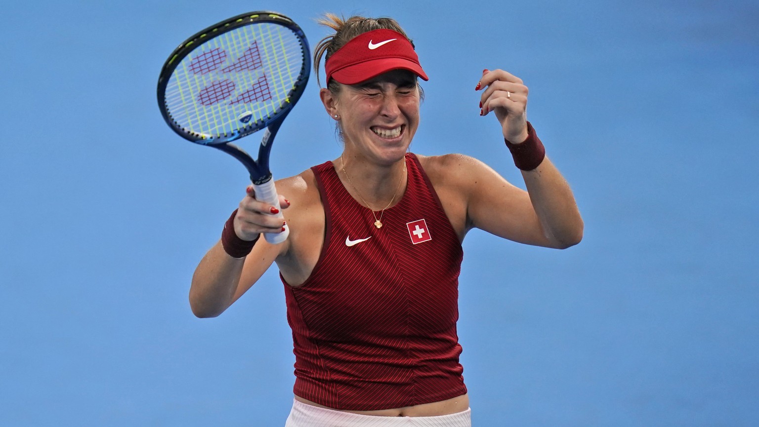 Belinda Bencic, of Switzerland, reacts after defeating Elena Rybakina, of Kazakhstan, during the semifinals of the tennis competition at the 2020 Summer Olympics, Thursday, July 29, 2021, in Tokyo, Ja ...