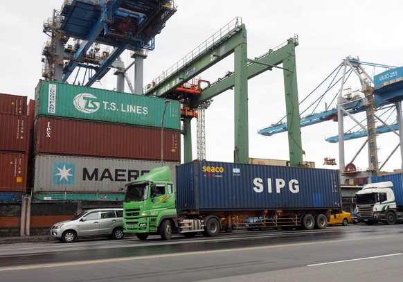 epa07976380 A truck drives through Keelung Harbor in Keelung City, Taiwan, 06 November 2019. According to a United Nations (UN) Conference on Trade and Development (UNCTAD) study released on 05 Novemb ...