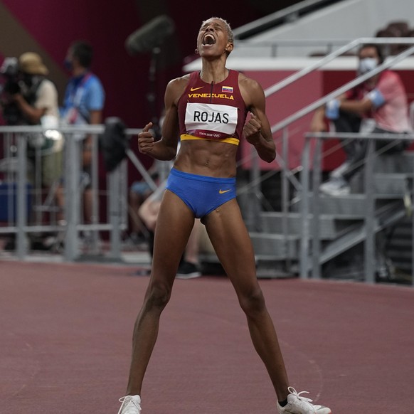 Yulimar Rojas, of Venezuela, celebrates after winning the final of the women&#039;s triple jump at the 2020 Summer Olympics, Sunday, Aug. 1, 2021, in Tokyo. (AP Photo/David J. Phillip)