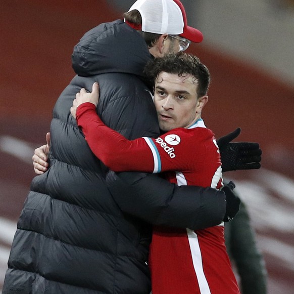 Liverpool&#039;s Xherdan Shaqiri hugs Liverpool&#039;s manager Jurgen Klopp after being substituted during the English Premier League soccer match between Liverpool and Manchester United at Anfield St ...