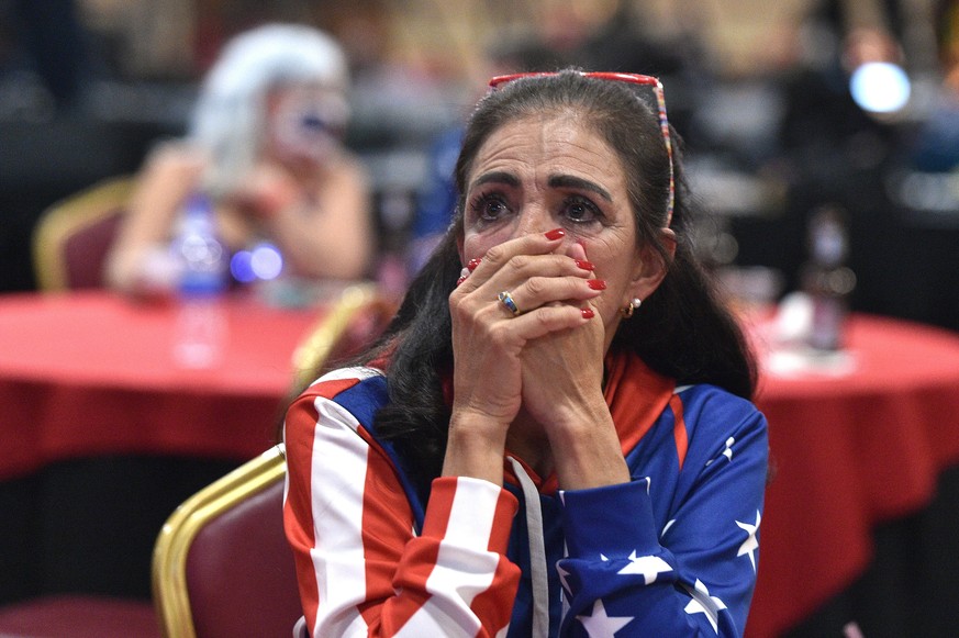 epa08797609 Loretta Oakes of Las Vegas reacts during a Republican watch party at the South Point Hotel &amp; Casino in Las Vegas, Nevada, USA, 03 November 2020. Americans vote on Election Day to choos ...
