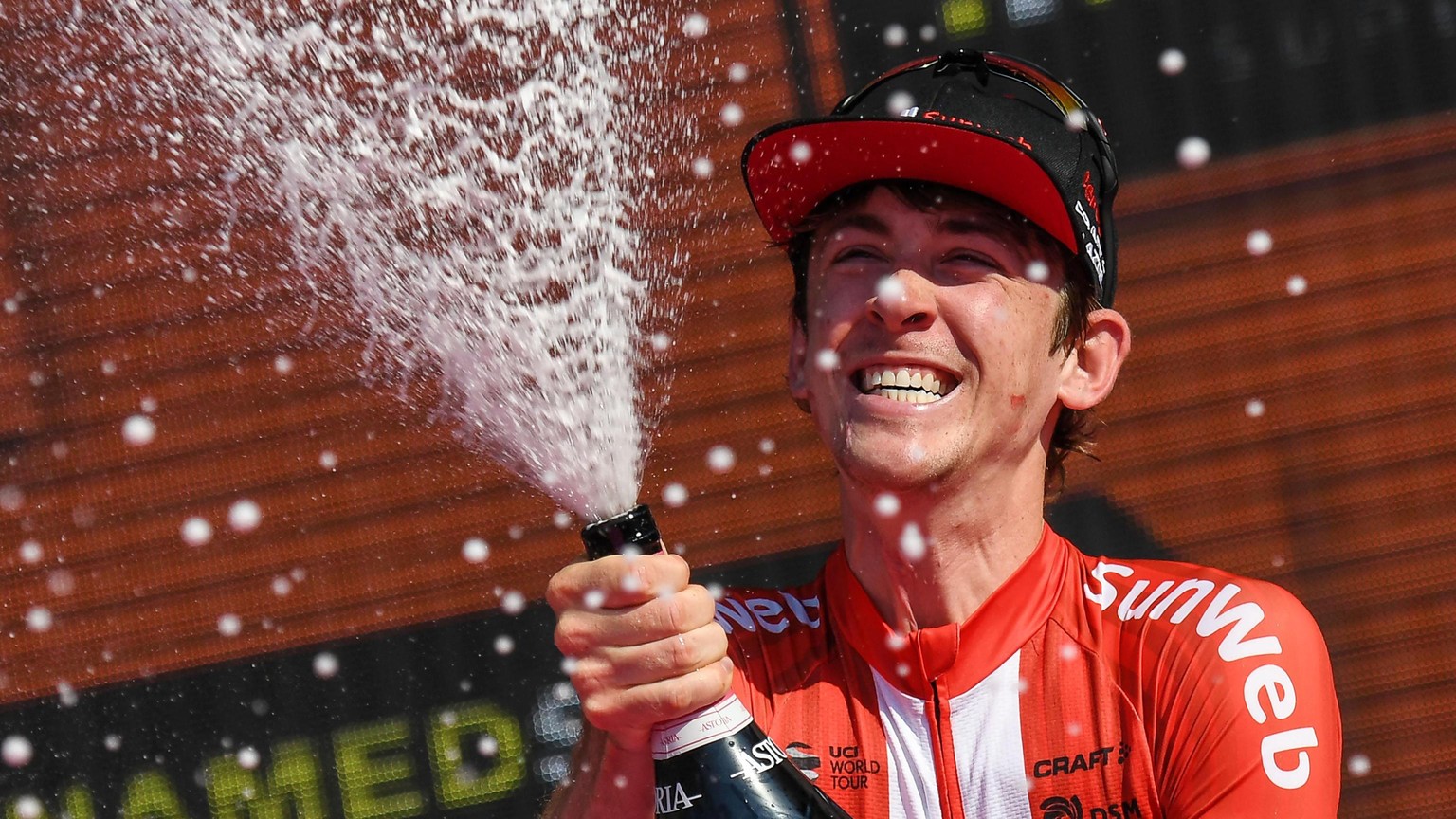 epa07620585 US cyclist Chad Haga of of Team Sunweb, celebrates on the podium after winning the 21st and last stage of the Giro d&#039;Italia cycling race, an individual time trial over 17 km in Verona ...