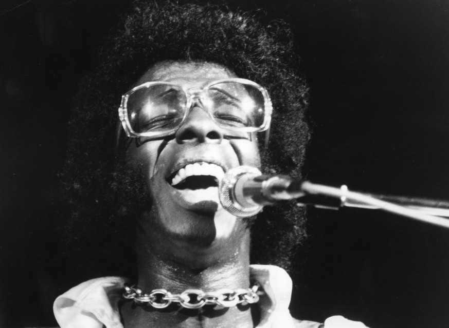 BETHEL, NY - AUGUST 17: Musician Sly Stone of the psychedelic soul group &quot;Sly And The Family Stone&quot; performs at the 1969 Woodstock Festival on August 17, 1969 in Bethel, New York. (Photo by  ...