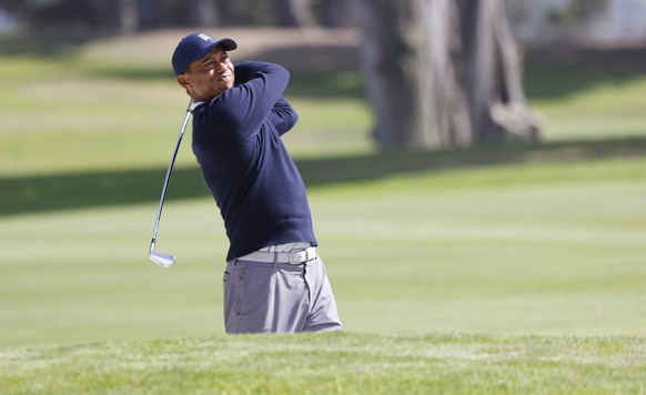 epa08590832 Tiger Woods of the US hits from the fairway on the eighth hole during the second round of the 2020 PGA Championship golf tournament at TPC Harding Park in San Francisco, California, USA, 0 ...