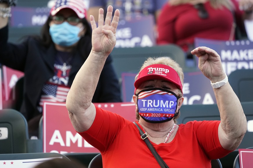 A supporter of President Donald Trump chants &quot;Four more years!&quot; during a &quot;Make America Great Again!&quot; event with Ivanka Trump at Bayfront Park Amphitheater, Tuesday, Oct. 27, 2020,  ...