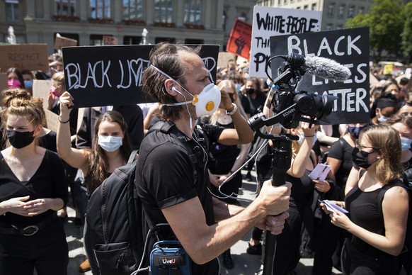 KEYSTONE-SDA video journalist Adrian Reusser in action during his live coverage of the demonstration against racism after the worldwide movement of the Black Lives Matter (BLM) protest against the rec ...