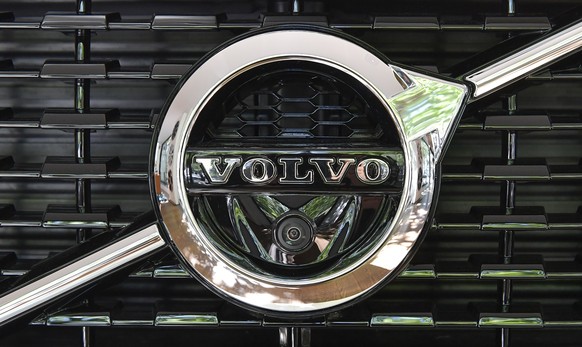 FILE- In this July 5, 2017, file photo, a Volvo logo is displayed on a vehicle at Volvo Cars Showroom in Stockholm, Sweden. Volvo is recalling more than 736,000 vehicles worldwide because the automati ...
