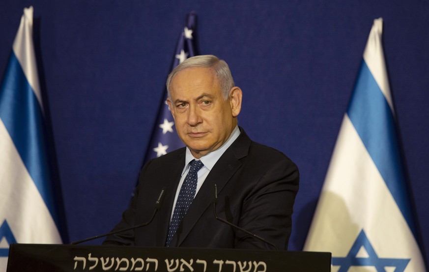 Israeli Prime Minister Benjamin Netanyahu listens during a news conference in Jerusalem, Thursday, Nov. 19, 2020. Israel