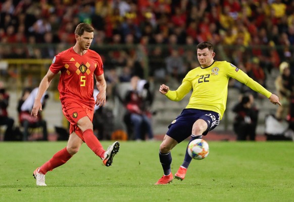epa07642022 Jan Vertonghen of Belgium (L) and Oliver Burke of Scotland in action during the UEFA EURO 2020, Group I qualifying soccer match between Belgium and Scotland at the King Baudouin stadium in ...