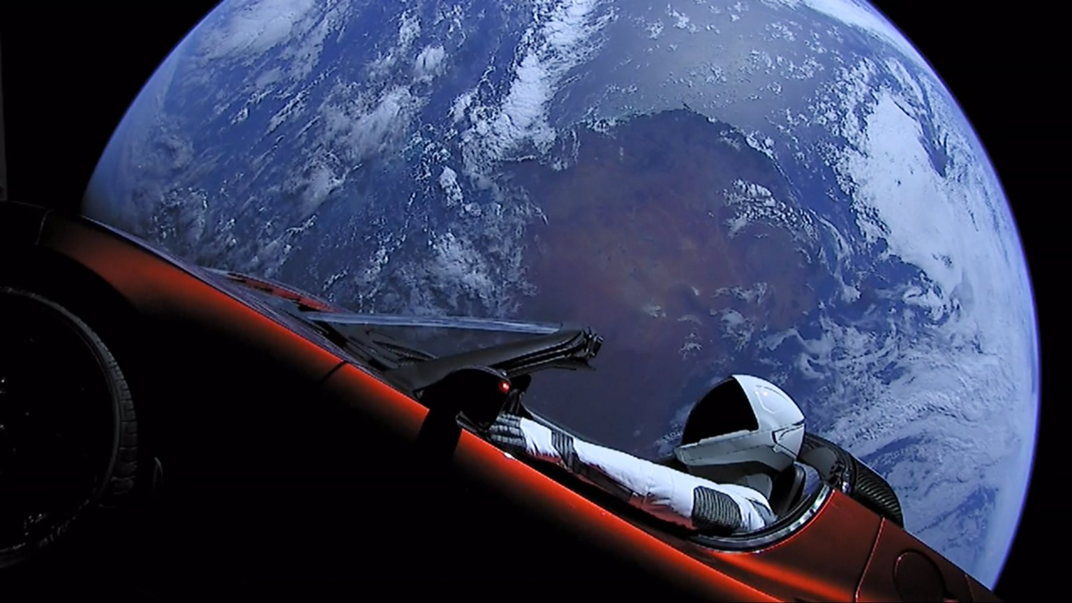 epa06506017 A handout photo made available by SpaceX on 08 Ferbuary 2018 shows a Tesla Roadster car in space after being launched with the SpaceX Falcon Heavy rocket, 06 February 2018. SpaceX, founded ...