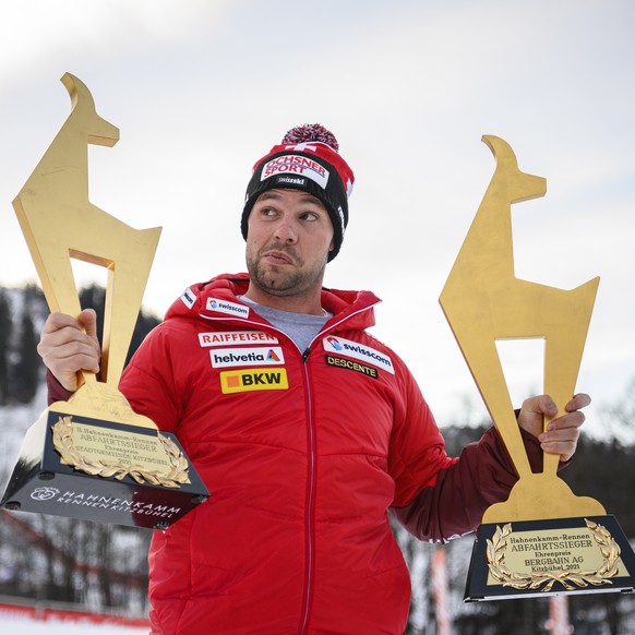 epa08962491 Beat Feuz of Switzerland poses for photographs with his Gams trophies after winning the two men&#039;s Downhill races of the FIS Alpine Skiing World Cup event in Kitzbuehel, Austria, 24 Ja ...