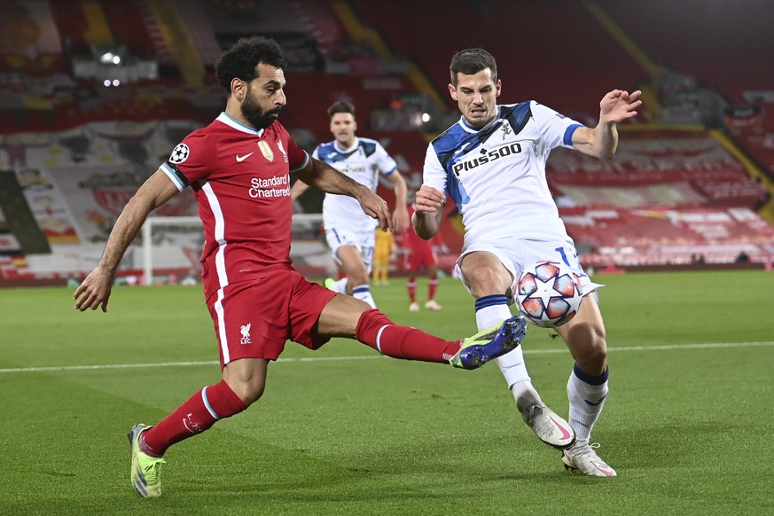 Liverpool&#039;s Mohamed Salah, left, vies for the ball with Atalanta&#039;s Remo Freuler during the Champions League group D soccer match between Liverpool and Atalanta at Anfield stadium in Liverpoo ...