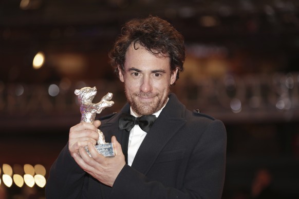 Actor Elio Germano holds the Silver Bear Best actor award for the film &#039;Volevo nascondermi&#039; (Hidden Away) after the award ceremony at the 70th International Berlinale Film Festival in Berlin ...