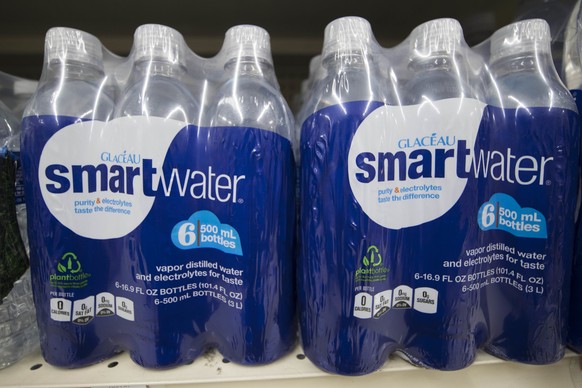 FILE - In this Thursday, March 16, 2017, file photo, bottles of Smartwater, a Coca-Cola Co. product, are displayed for sale at a supermarket in Philadelphia. The Coca-Cola Co. reports earnings, Wednes ...