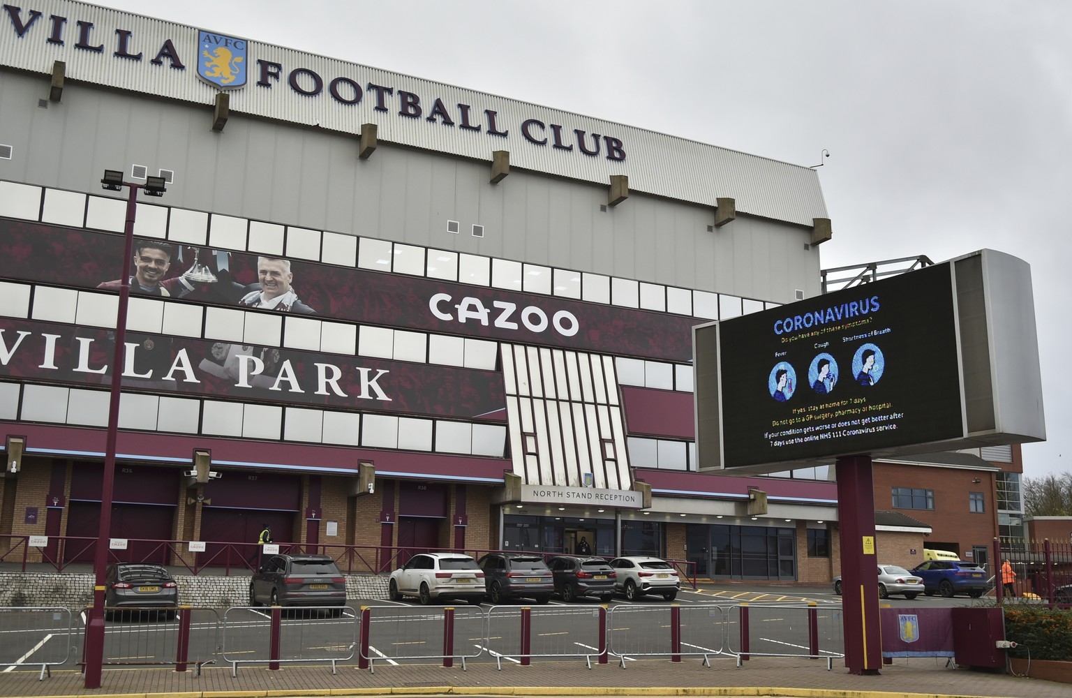 FILE - This Saturday, Nov. 21, 2020 file photo shows a general view of a social distancing message on display outside the Villa Park stadium, home of Aston Villa, in Birmingham, England. Aston Villa h ...