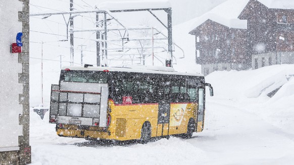 The Postauto bus in Niederwald at the district of Goms, Switzerland, on Monday 22nd January 2018. Due to heavy snowfall, the train track is shut down between Fiesch and Oberwald. The roads are closed  ...