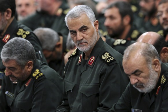 FILE- In this Sept. 18, 2016 photo released by an official website of the office of the Iranian supreme leader, Revolutionary Guard Gen. Qassem Soleimani, center, attends a meeting with Supreme Leader ...