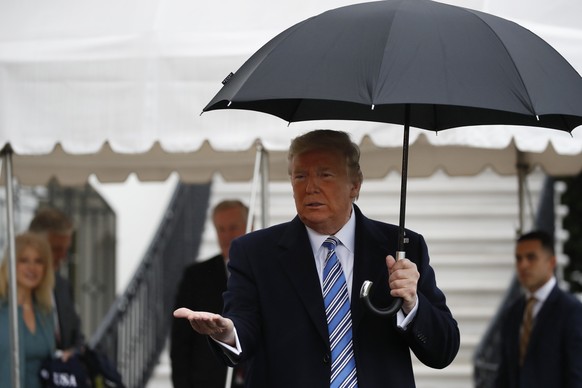 President Donald Trump stops while walking to Marine One to depart the White House, Saturday, March 28, 2020, in Washington. Trump is en route to Norfolk, Va., for the sailing of the USNS Comfort, whi ...