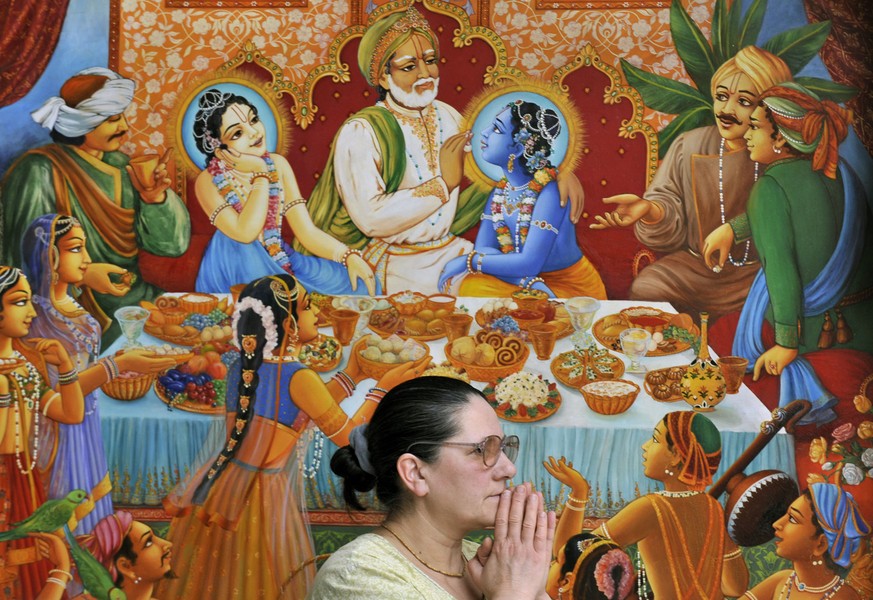 A Krishna worshiper attends a temple service in the Krishna Valley of Somogyvamos (180km/110miles south-west of Budapest) Hungary, Sunday, Feb. 8, 2009. Some 200 of Krishna believers live separated fr ...