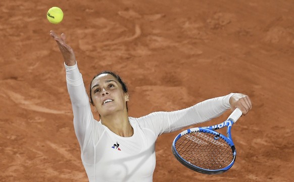epa08709653 Martina Trevisan of Italy serves during her second round match against Coco Gauff of the US at the French Open tennis tournament at Roland Garros in Paris, France, 30 September 2020. EPA/J ...