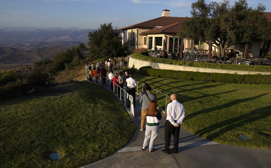 Voters stand in line at the Ronald Reagan Presidential Library and Museum Tuesday, Nov. 3, 2020, in Simi Valley, Calif. (AP Photo/Mark J. Terrill)