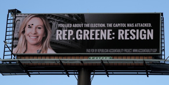 An LED billboard calling for the resignation of Rep. Marjorie Taylor Greene, R-Ga., is seen on Tuesday, Feb. 2, 2021, in Dalton, Ga. (AP Photo/Ben Margot)