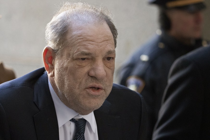 FILE - In this Feb. 21, 2020, file photo, Harvey Weinstein arrives at a Manhattan court as jury deliberations continue in his rape trial in New York. Weinstein tested positive for the coronavirus at a ...