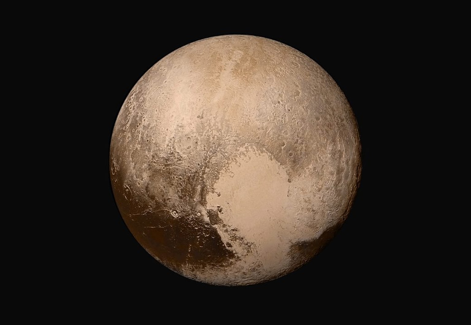 epa04859033 A handout image provided by NASA on 24 July 2015 shows the dwarf planet Pluto. Four images from New Horizons’ Long Range Reconnaissance Imager (LORRI) were combined with color data from th ...