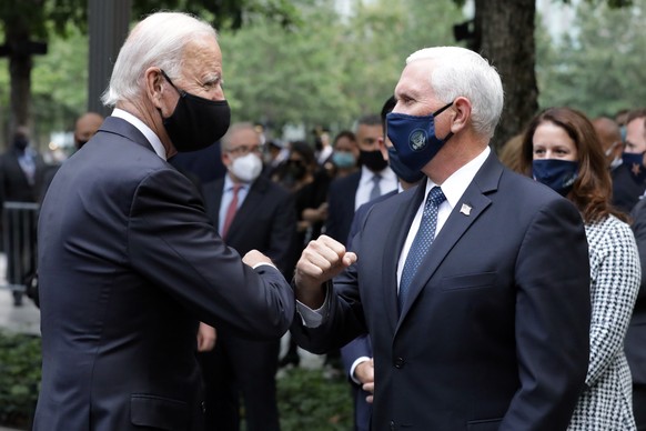 Democratic presidential candidate former Vice President Joe Biden greets Vice President Mike Pence at the 19th anniversary ceremony in observance of the Sept. 11 terrorist attacks at the National Sept ...