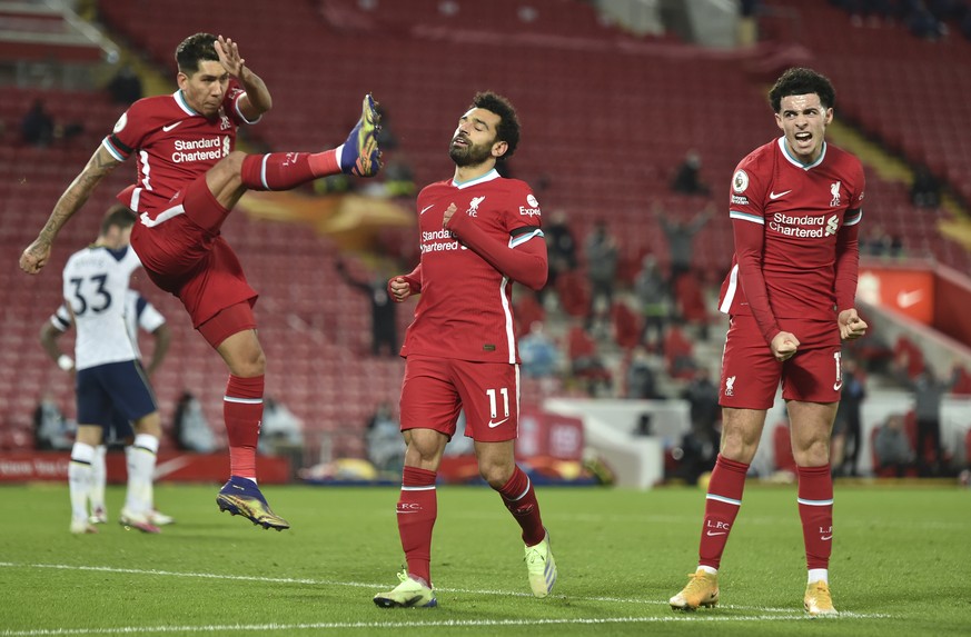 Liverpool&#039;s Mohamed Salah, center celebrates with teammates Liverpool&#039;s Roberto Firmino, left and Liverpool&#039;s Curtis Jones after scoring the opening goal of the game during their Englis ...