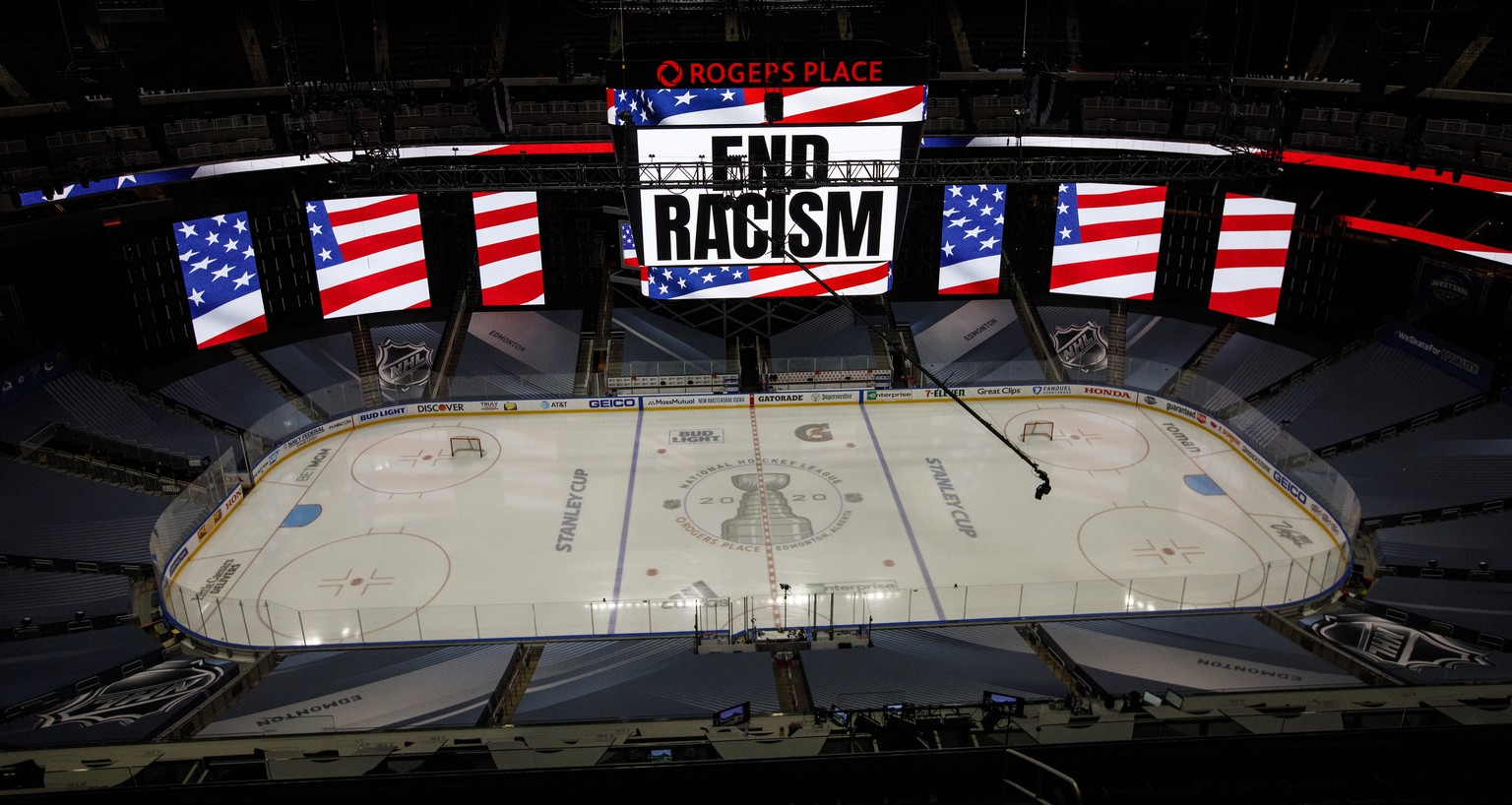 An End Racism sign is displayed before Game 3 of an NHL hockey second-round playoff series between the Colorado Avalanche and the Dallas Stars, Wednesday, Aug. 26, 2020, in Edmonton, Alberta. (Jason F ...