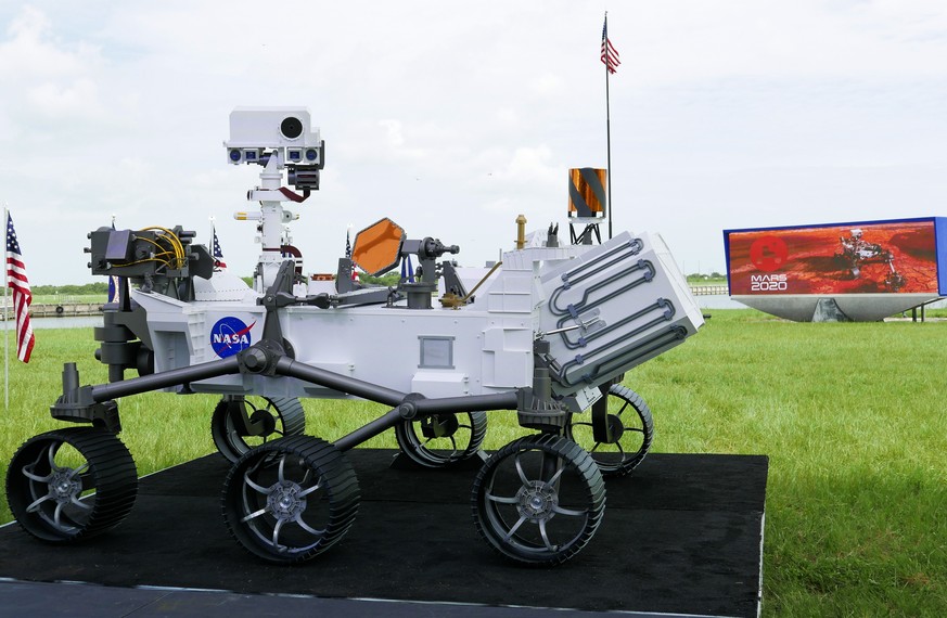 A replica of the Mars rover Perseverance is displayed outside the press site before a news conference at the Kennedy Space Center Wednesday, July 29, 2020, in Cape Canaveral, Fla. United Launch Allian ...