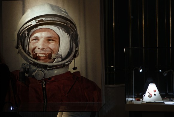 An undated portrait of the first man in space, Yuri Gagarin, and his award of the Hero of the Soviet Union, at right, part of an exhibition dedicated to the 50th anniversary of the first man in space, ...
