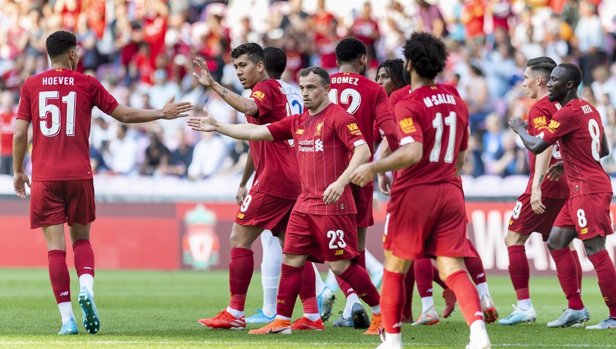 The Liverpool players let their joy burst out so Xherdan Shaqiri, center, during a friendly soccer match between Liverpool FC and French Olympique Lyonnais at the Stade de Geneve stadium, in Geneva, S ...