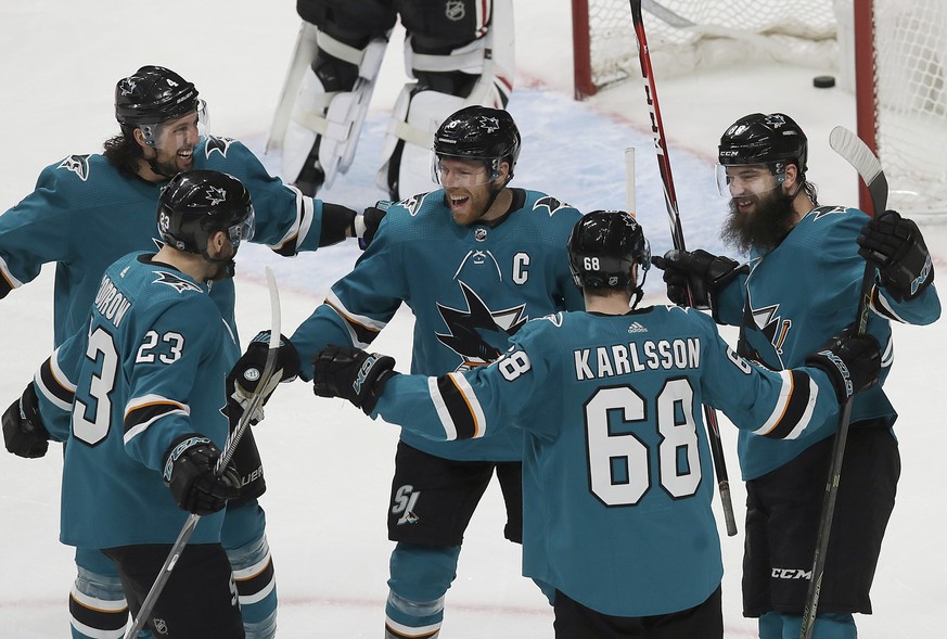 San Jose Sharks center Melker Karlsson (68) celebrates with teammates after scoring a goal against the Chicago Blackhawks during the third period of an NHL hockey game in San Jose, Calif., Sunday, Mar ...