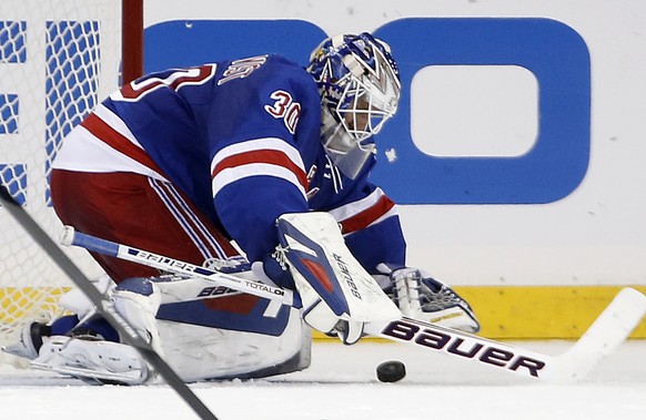 New York Rangers goalie Henrik Lundqvist (30) of Sweden makes a save in the second period of their NHL hockey game against the Washington Capitals at Madison Square Garden in New York, Sunday, Jan. 19 ...