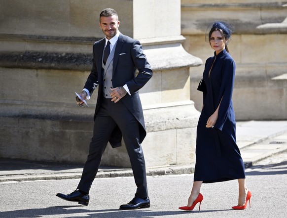 epa06748935 British former soccer player David Beckham (L) and Victoria Beckham (R) arrive for the royal wedding ceremony of Britain&#039;s Prince Harry and Meghan Markle at St George&#039;s Chapel in ...