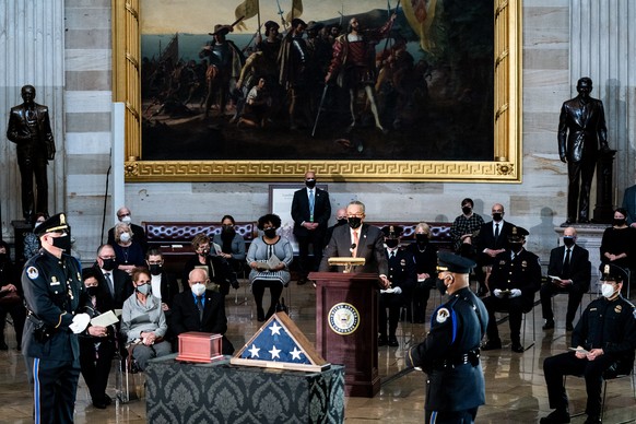 epa08984974 Senate Majority Leader Chuck Schumer (D-NY) speaks during a congressional tribute to the late Capitol Police officer Brian Sicknick who lies in honor in the Rotunda of the Capitol in Washi ...