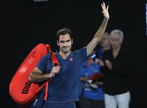 Switzerland&#039;s Roger Federer waves as he leaves Rod Laver Arena after losing his fourth round match against Greece&#039;s Stefanos Tsitsipas at the Australian Open tennis championships in Melbourn ...