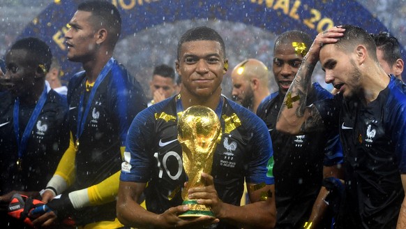 epaselect epa06891526 Kylian Mbappe of France reacts with the trophy after winning the FIFA World Cup 2018 final between France and Croatia in Moscow, Russia, 15 July 2018.

(RESTRICTIONS APPLY: Edi ...