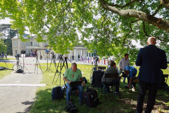 epa09276512 Members of the media wait outside Villa La Grange during the U.S.-Russia summit in Geneva, Switzerland, 16 June 2021. US President Biden and Russian President Putin meet in Geneva on 16 Ju ...