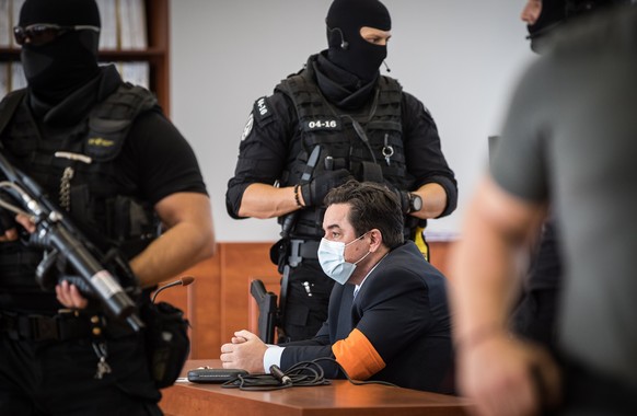 epa08643707 Slovak businessman Marian Kocner (C) waits to be escorted from the main trial concerning the murder of journalist Jan Kuciak and his fiance Martina Kusnirova after he was acquitted of char ...