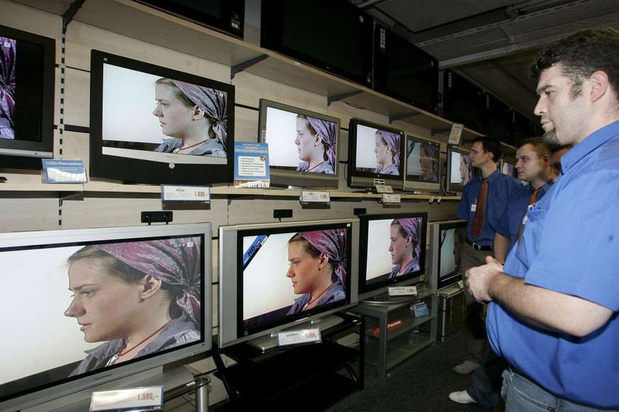 Employees of a department store watch the interview with Austrian kidnapping victim Natascha Kampusch at Austrian television channel ORF in Vienna, Wednesday 06 September 2006. 

Publication of this ...