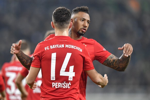 Bayern&#039;s Ivan Perisic, left,, celebrates with Bayern&#039;s Jerome Boateng after scoring his side&#039;s first goal during the German Bundesliga soccer match between Borussia Moenchengladbach and ...