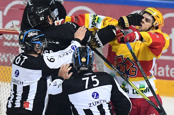 LuganoÕs player Alessandro Chiesa, left, fights with Biel&#039;s player Marc-Antoine Pouliot, right, during the preliminary round game of National League Swiss Championship between HC Lugano and EHC B ...